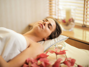 woman-in-wrapped-in-white-towel-lying-on-bed-with-eyes-3757942.jpg